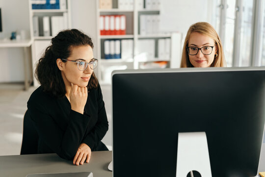Two young woman working on a business team