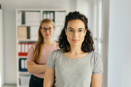 Two young businesswomen in office