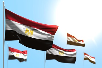 beautiful 5 flags of Egypt are wave against blue sky image with selective focus - any holiday flag 3d illustration..