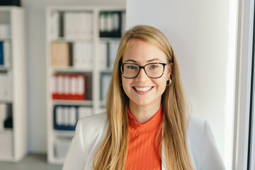 Friendly businesswoman with welcoming smile © contrastwerkstatt