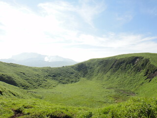 An old crater of Mt.Kijima and small eruption of Mt.Aso(active volcano) in Kumamoto Japan
