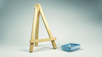 wooden easel with paint roller
