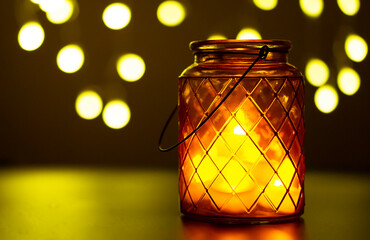 Obraz na płótnie Canvas Glass jar with lit LED light inside on dark horizontal background