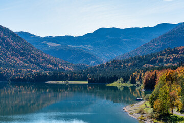 Fototapeta na wymiar Sylvenstein reservoir lake in autumn, Bad Toelz, Bavaria, Germany, Europe