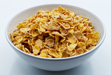 Cornflakes in a bowl isolated on white background