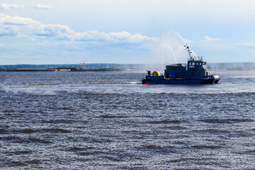 Extinguishing a burning ship during naval exercises