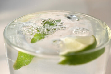 Refreshing lemonade with slices of lime
