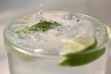 Refreshing lemonade with slices of lime