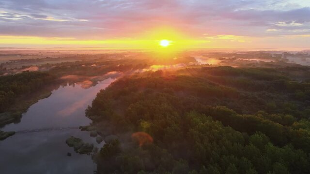 Colourful sunrise over Sava River in Croatian countryside, 4K aerial panoramic