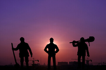 Cityscape building and workers team silhouette in twilight time, foreman and team standing with building.