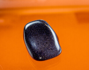 a darkblue aventurine glass with a sparkling blue surface.