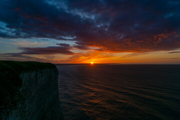 Fototapeta na wymiar The sunsets over the sea near Thornwick Bay, Flamborough Head, East Yorkshire, UK