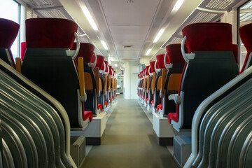 Obraz premium Empty train seats. No people inside the train wagon.