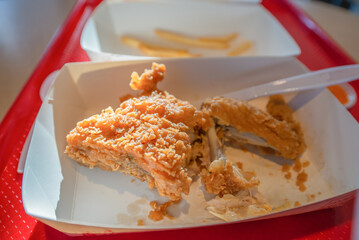 Fried chicken leftover in paper box