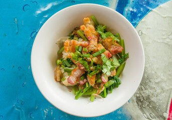 Egg noodle with roasted pork , pork wonton and steamed kale