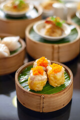 Pork siew mai steam dumpling in bamboo steamer
