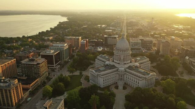 Aerial view of City of Madison. The capital city of Wisconsin from above. Drone flying over Wisconsin State Capitol in downtown. Sunny morning, sunrise (sunset), sunlight, summertime