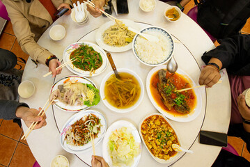 Chinese foods on circle table from above view