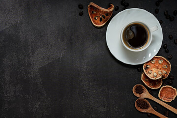 Cup of coffee and Coffee composition on black background. Copy space. Top view. Flat lay.