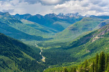 Obraz na płótnie Canvas The mountains and valleys in Glacier National Park, Montana, on a cloudy day.