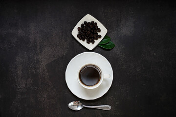Cup of coffee and Coffee composition on black background. Copy space. Top view. Flat lay.