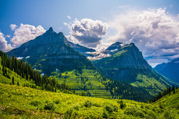 Fototapeta premium The mountains and valleys in Glacier National Park, Montana, on a cloudy day.