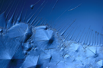 blue ice glass background, abstract texture of the surface of the ice on the glass, frozen seasonal water