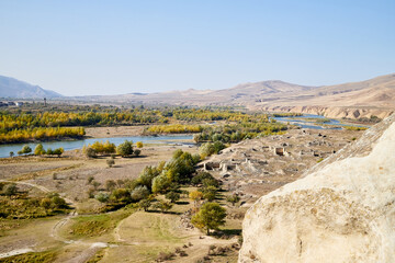 Autumn landscapes with fantastic views from mountain to valley and blue river. Colourful mountain nature in autumn, summer, or spring day