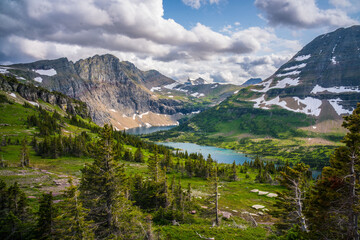 The hidden lake and mountains in Glacier National Park, in Montana, on a cloudy day.