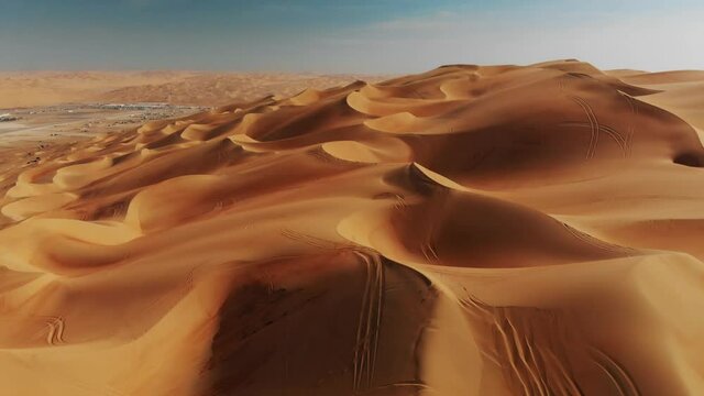 Moheeb dune in the empty quarter desert, moving forward view of an arid landscape composed of sand and dunes near Liwa oasis, must-see destination in UAE and Dubai