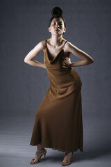 Fototapeta premium Woman posing in evening dress