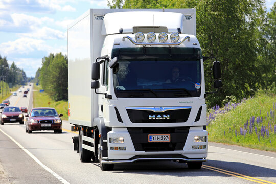 White MAN TGM Delivery Truck on Summer Road