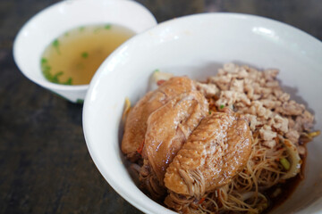 Close up bowl of dry chicken noodle