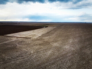 Agricultural machinery in the field, aerial view. Agricultural work.