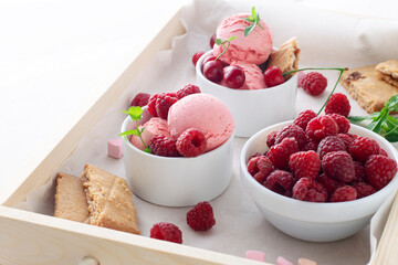 Berry ice cream on a tray. Delicious summer dessert.