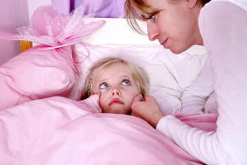 A woman comforting her terrified daughter