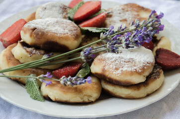 Breakfast with cottage cheese pancakes and strawberry stock photo