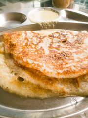 Home made dosa in a steel plate.