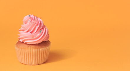 Pink cupcakes on a yellow background