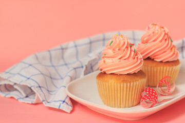 Pink cupcakes on a pink background