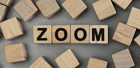 Word ZOOM made with wood building blocks. Top view