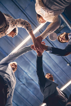 Group of executive placing their hands together