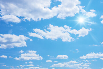 blue sky with sun and clouds background