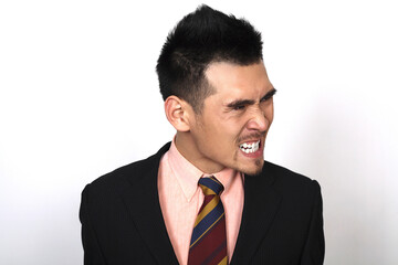 Angry businessman clenching teeth