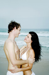 Fototapeta premium Couple hugging each other on the beach