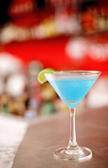 A glass of cocktail on the bar counter