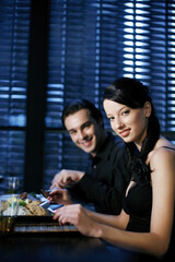 Couple enjoying their meal in a luxurious restaurant