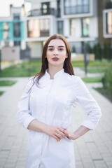 Fototapeta premium beautiful brunette doctor girl poses for the photographer
