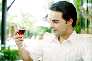 Man enjoying a glass of red wine