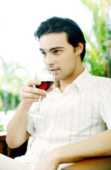 Fototapeta premium Man enjoying a glass of red wine